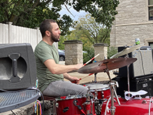 Photo of grad student John Thomas on drums